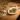 Plate of diverse food on wooden table