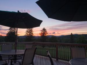Mulligan's Pub at Windham Country Club deck and tables at sunset