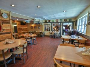 The tap room with dining tables at rip van winkle brewing company restaurant