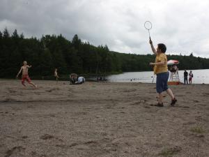 Family playing badminton on the beach North South Lake