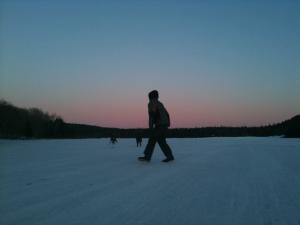 winter hiker at North South Lake during sunset