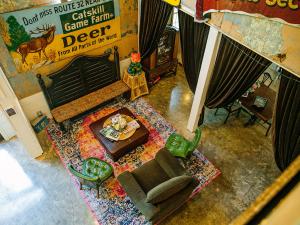 View of the common room from above at the Long Neck Inn with an original Catskill Game Farm directional sign