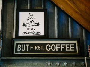 Always say yes to adventure and a but first coffee sign at the Long Neck Inn