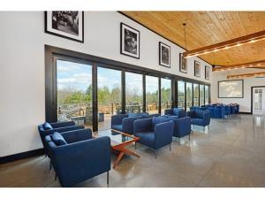 Indoor cushioned blue chairs at The Vineyard at Windham