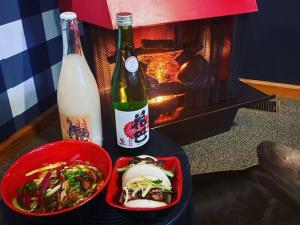 sake and food by the fire in room 1