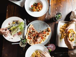 Patrick Henrys food on table with people eating