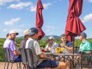 men at table drinking beer summer