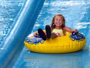 Zoom Flume Water Park girl tubing on the lazy river