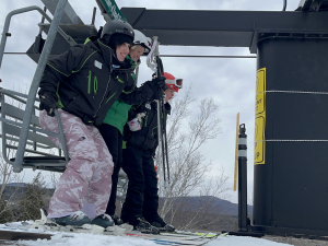 ASF Student Olivia Calamita and others getting off the chairlift