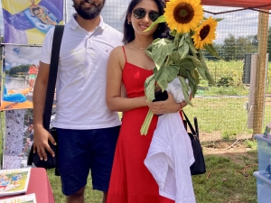 couple with sunflowers