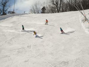 Four skiiers on Hunter Mountain Resort