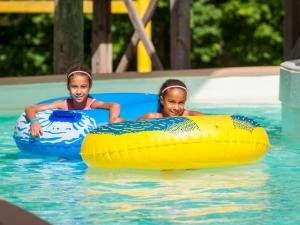 Zoom Flume Water Park 2 girls tubing on the lazy river