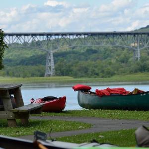 Kayaks and canoes by the Hudson River