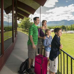 family on an outdoor balcony at a Catskills family resort