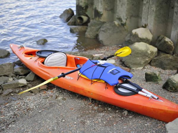 orange kayak on the shore of the Hudson River