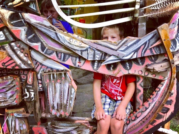 Child sitting in sculpture 