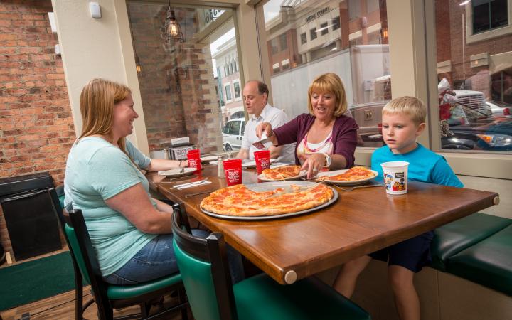 family eating pizza