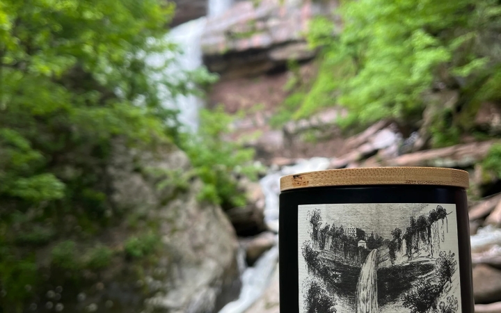 candle by waterfall